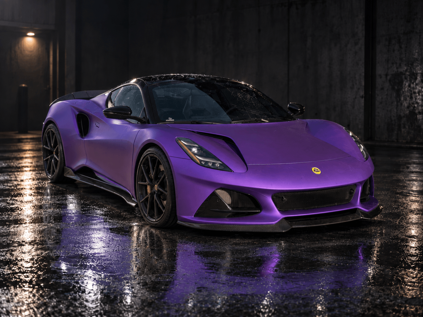Lotus Emira wrapped in satin purple vinyl with black roof